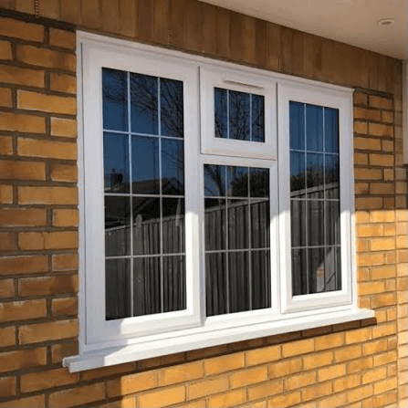 White uPVC windows on a red brick house exterior